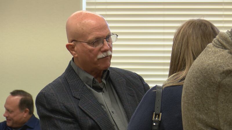 Randy Cooper making conversation at his retirement party.